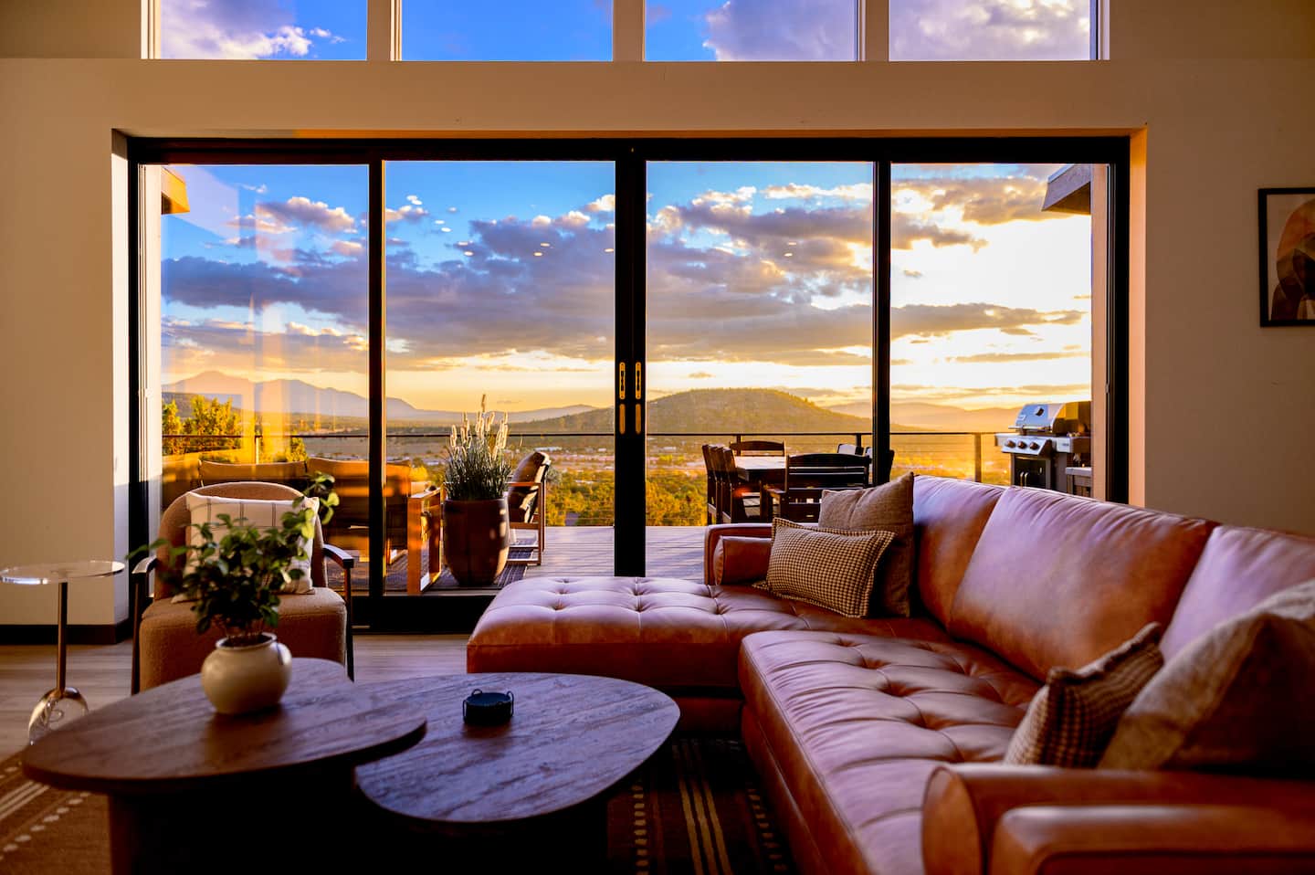 Living room with glass doors at sunset