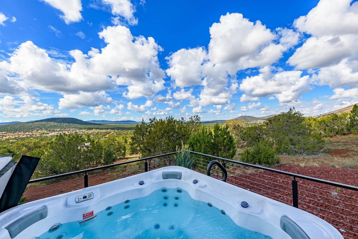 Hot tub on the deck under a blue sky